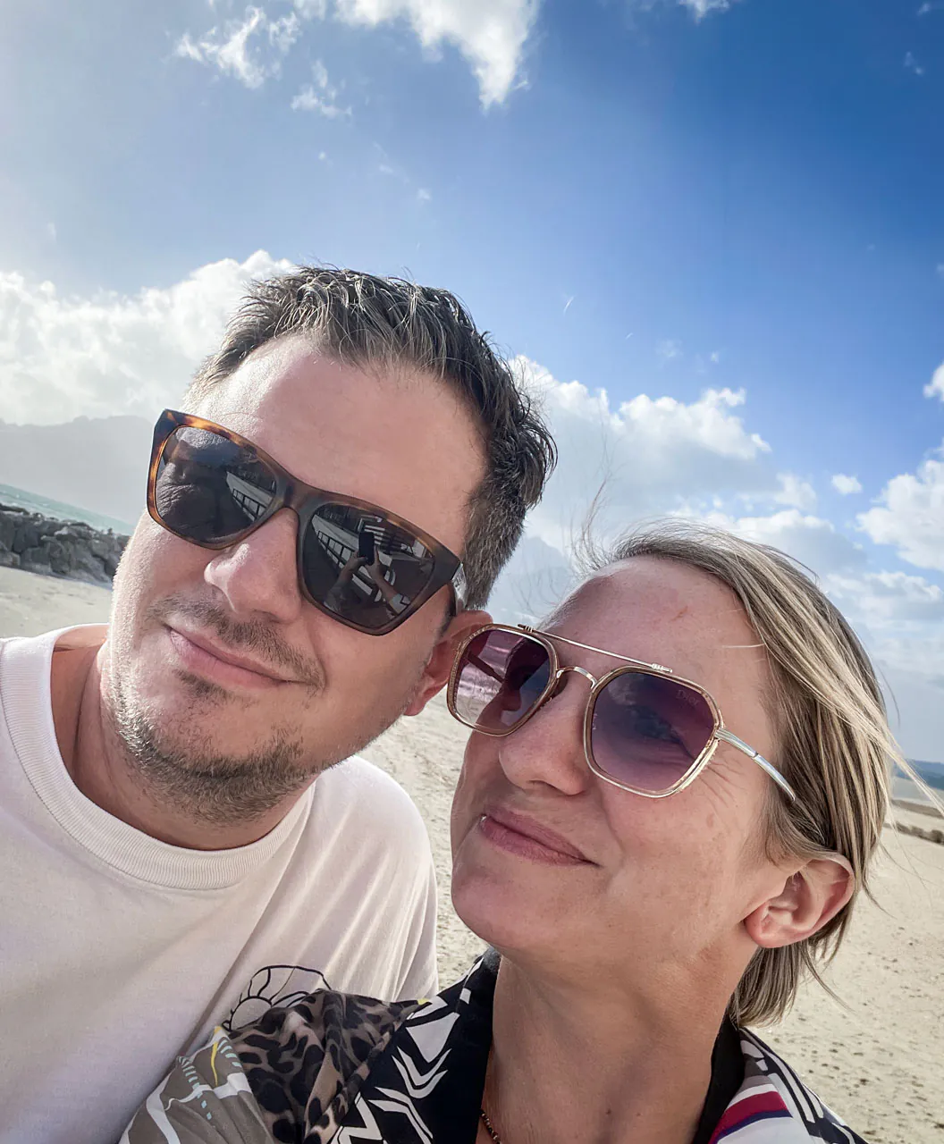 Anke and Sebastian, hosts of Feelgood Sicily, on the beach on Sicily’s south coast near Ispica